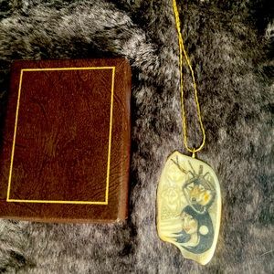 Handmade scrimshaw necklace with chain.